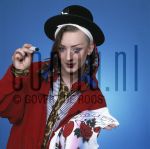 02-04-1983 Boy George at studio in Amsterdam. April 02, 1983.

[keywords]Posed, Half Length, Smiling, Hat[/keywords]